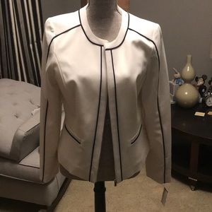 White and black jacket with tags